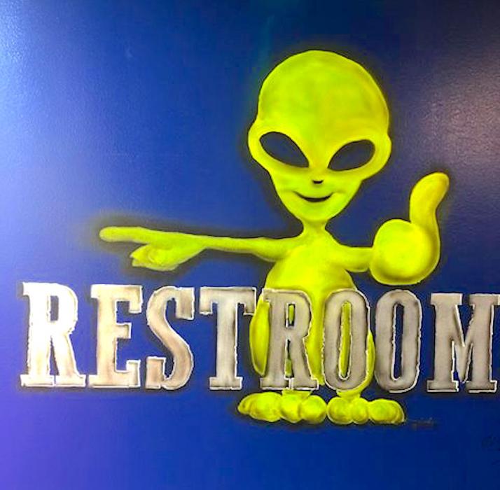 Photo courtesy Mauricio Sandoval, painted this mural inside the Squeeze In.