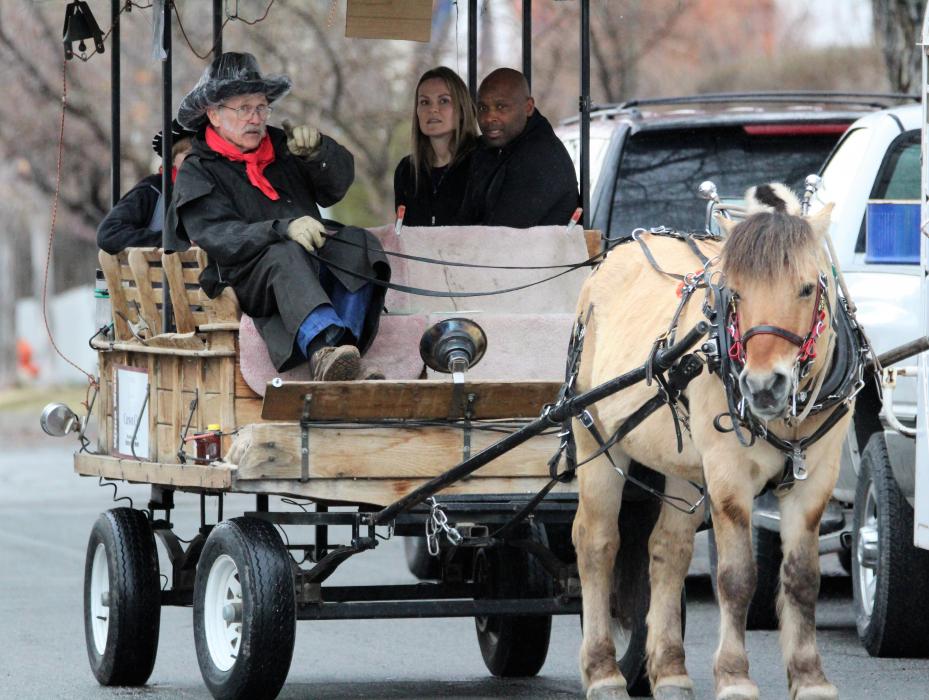 Hoof Beats horse-drawn taxi transports Wine Walk guests down W. Telegraph Street.