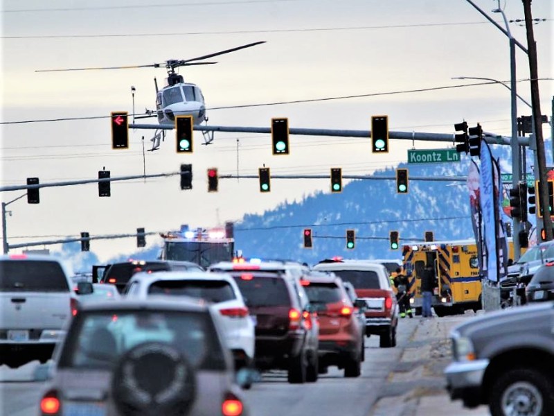 Photo by Brett Fisher. Care Flight lands on South Carson Street, site of a rollover crash on Dec. 22, 2018.
