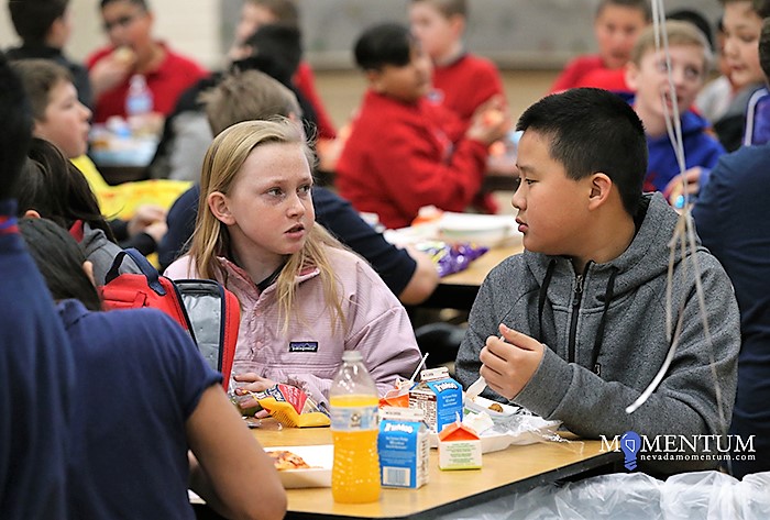 Photo by Cathleen Allison/Nevada Momentum. Jocelyn Pedersen invited Jason Jia, both 12, to join her lunch group Thursday.