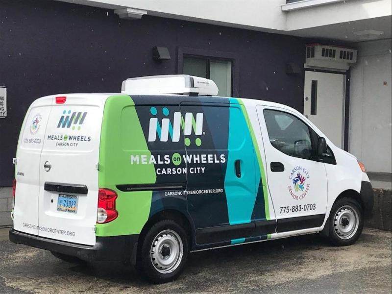 The Carson City Senior Center celebrates March for Meals with its newly wrapped food delivery vehicles.