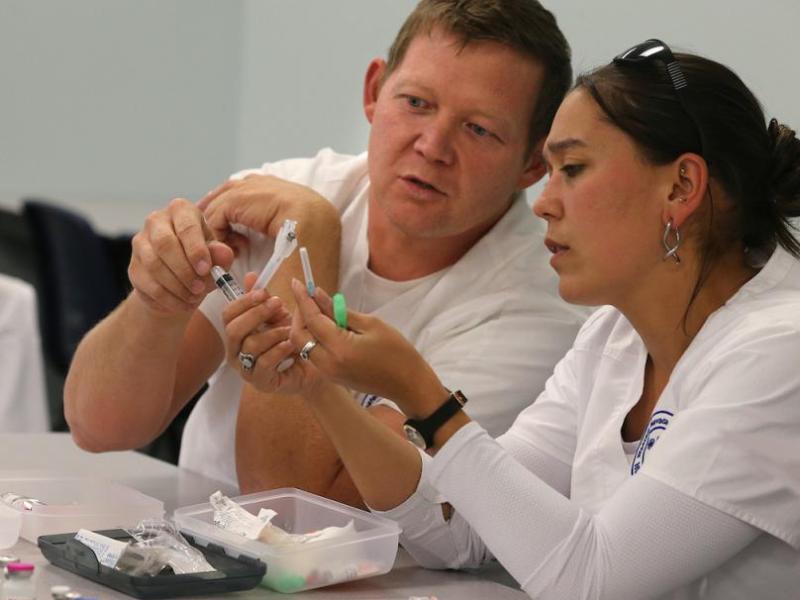 Joseph Yeargan and Niki Perry work in a nursing class at WNC in Carson City. File photo