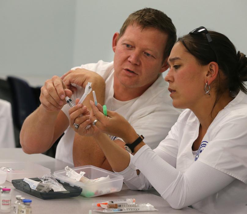 Joseph Yeargan and Niki Perry work in a nursing class at WNC in Carson City. File photo