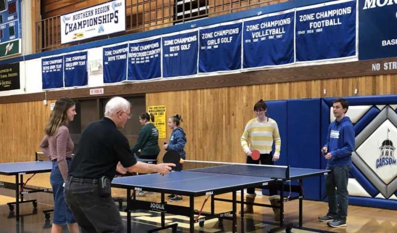 CHS teacher Mike Rudolph teaching students to play Table Tennis at lunchtime during the week of CHS Unplugged.