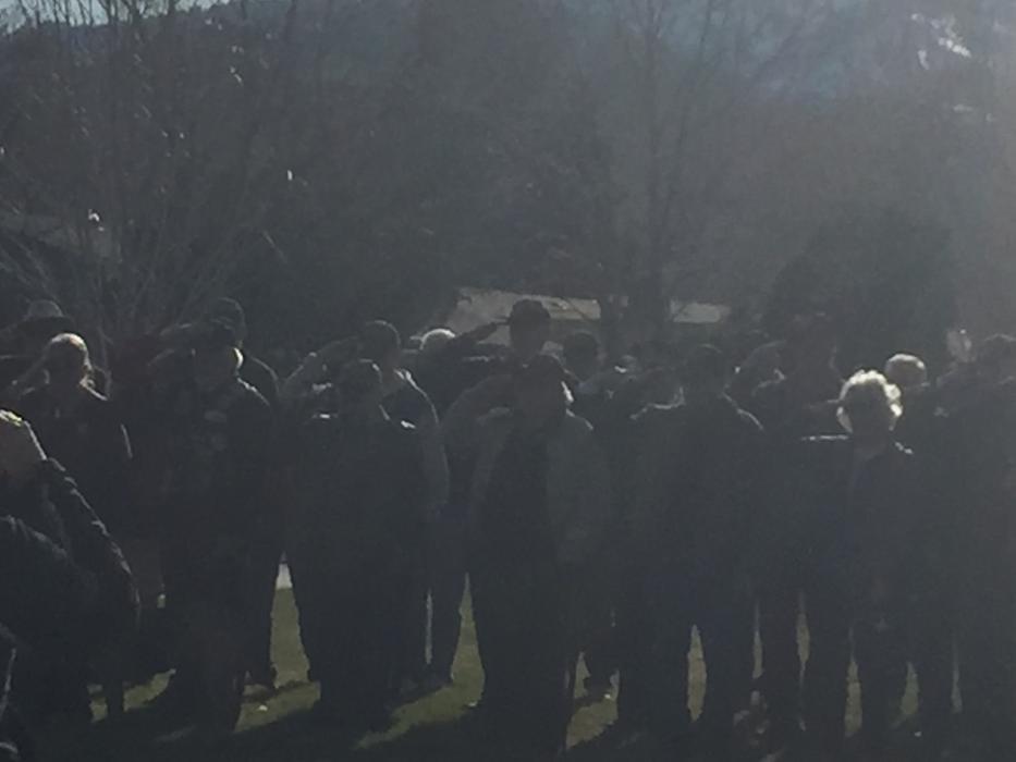 Vietnam Veterans stand in salute of the fallen during the Vietnam Veterans Day Rememberance ceremony at Mills Park today.