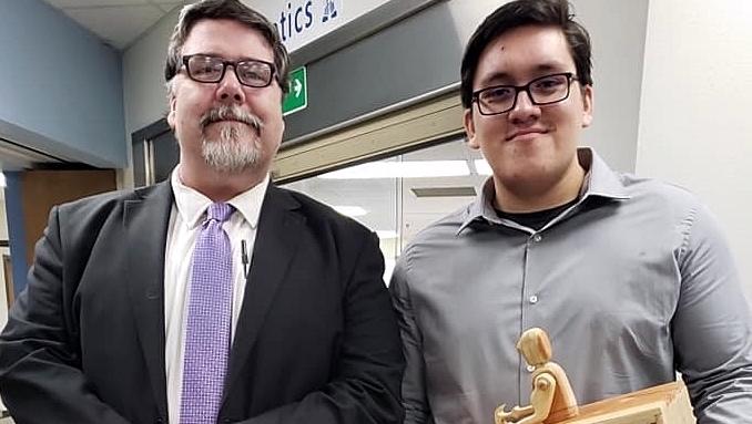 CHS English teacher Patrick Tobin with senior Miguel Prado and his Senior Project.