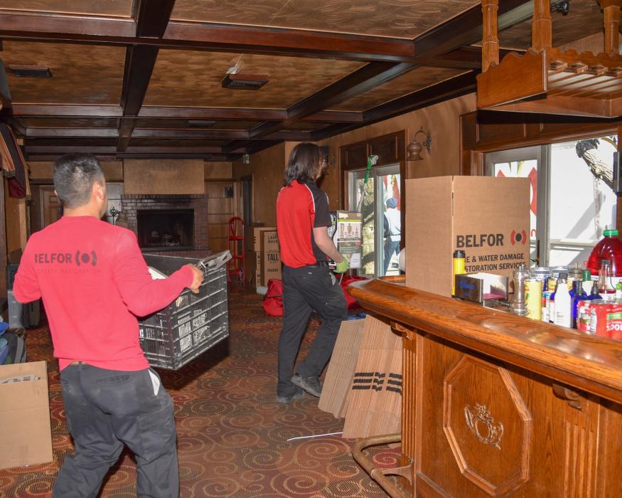 Haulers move equipment Thursday at the restaurant.