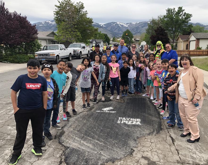 Mark Twain Elementary School third graders line up for a Paving for Pizza photo Tuesday.