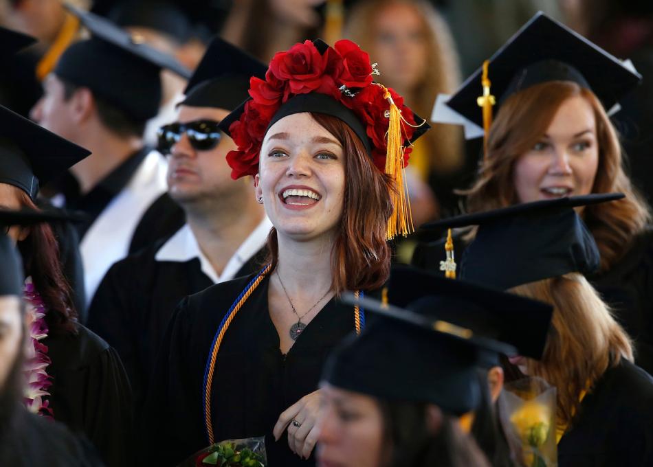 MaShawn Rowley celebrates with fellow graduates at the 2019 commencement for Western Nevada College on Monday in Carson City.