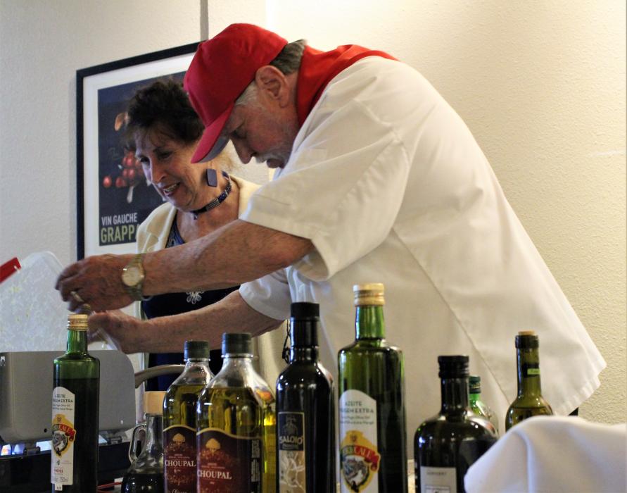 Chef Don Pepe Paz works his magic for the crowd at Bleu Cafe with a volunteer assistance from the audience.