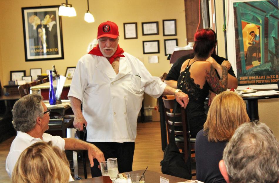 Chef Don Pepe Paz greets his audience Tuesday night at the Bleu Cafe.