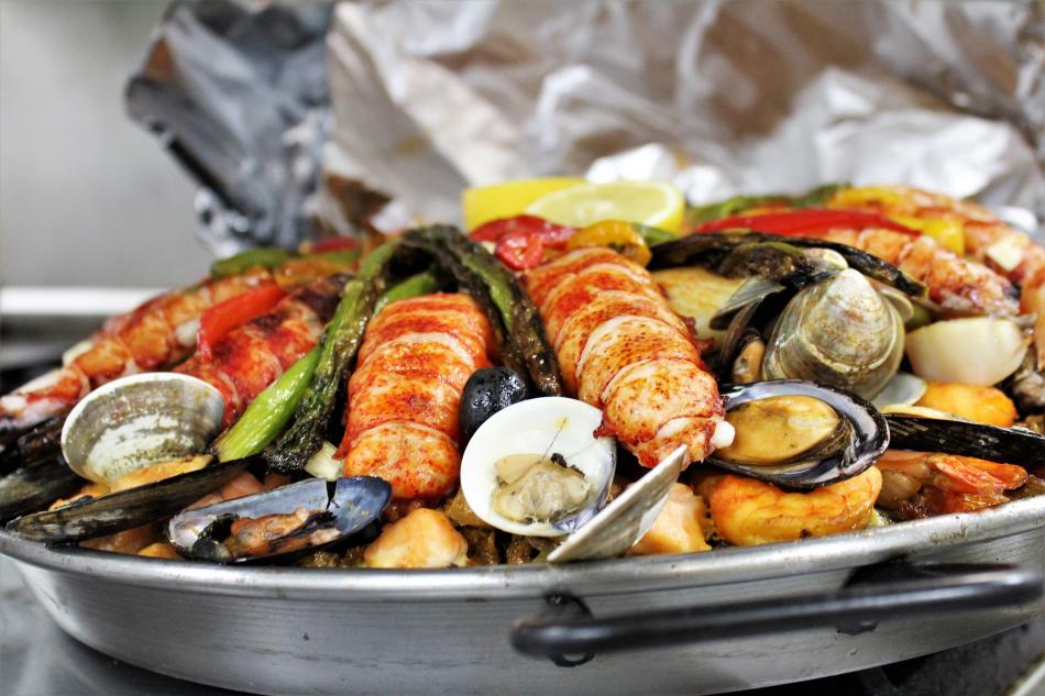 Spanish Paella highlighted by a variety of fine seafood and cooked using Portuguese olive oil.