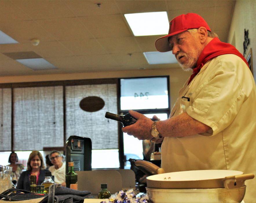 Chef Don Pepe Paz talks wine and olive oil with his audience Tuesday night at the Bleu Cafe.