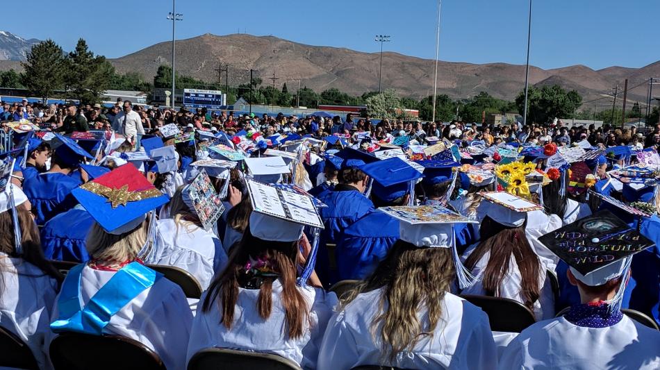 Several academic caps were decorated with plenty of color and pop.