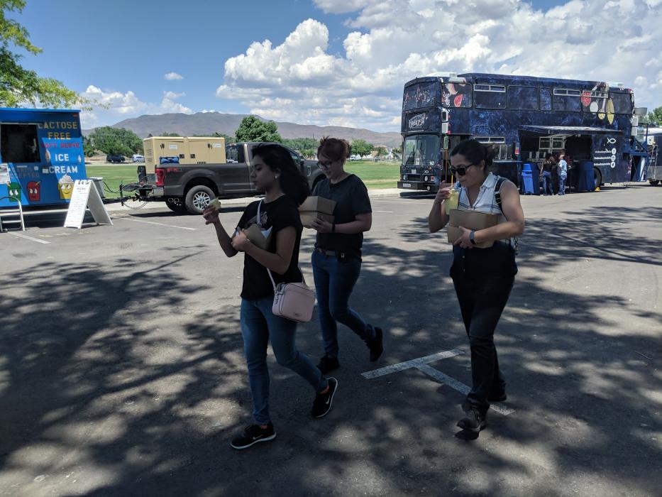 Participants had their hands full carrying hot-to-order food and ice cream.