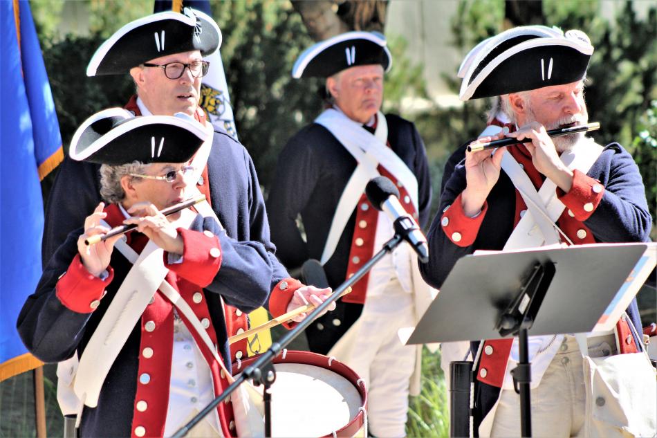 The Sons of the American Revolution, Battle Born Patriots Chapter, entertain visitors with Patriotic fife and drum music.