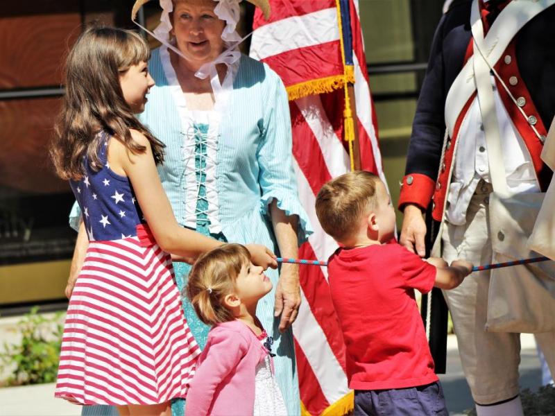 Photos by Brett Fisher. Children ring the replica Liberty Bell Thursday at the Nevada State Museum.
