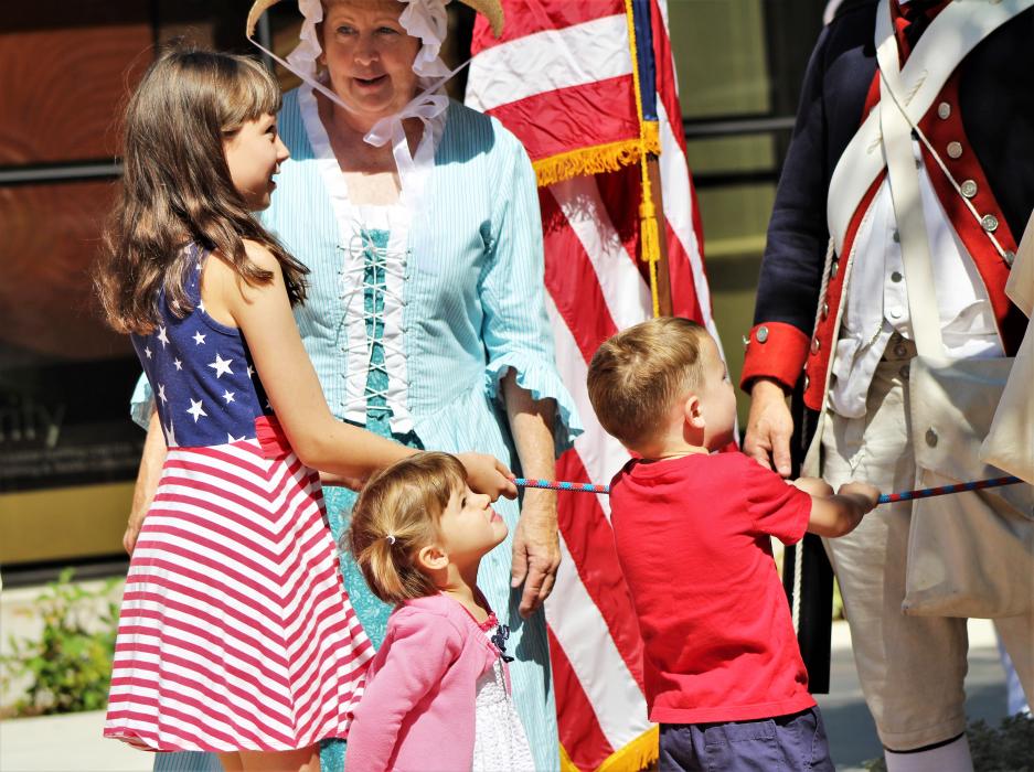 Photos by Brett Fisher. Children ring the replica Liberty Bell Thursday at the Nevada State Museum.