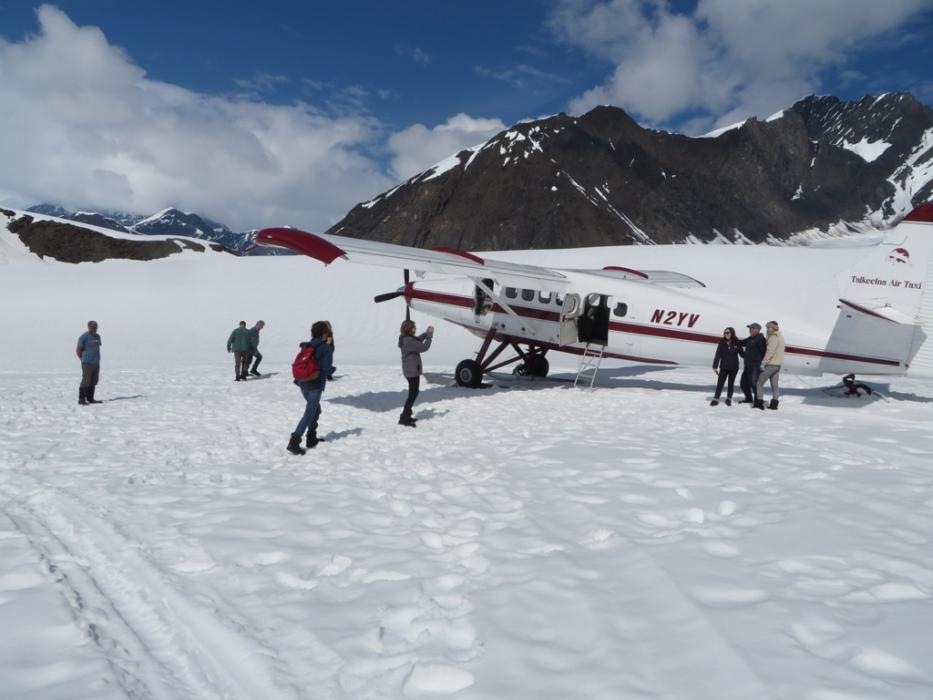 Passengers taking photos after landing on Ruth Glacier.
