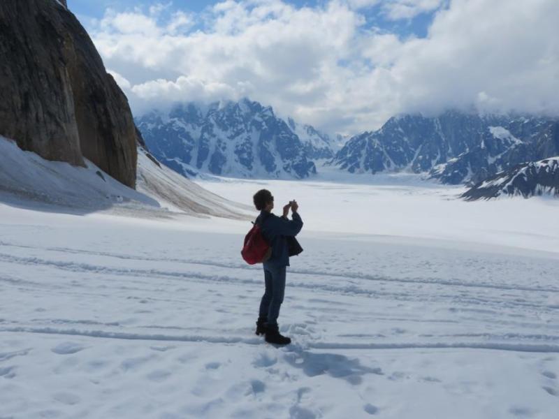 Elaine Quilici taking photos of the scenery around Ruth Glacier.