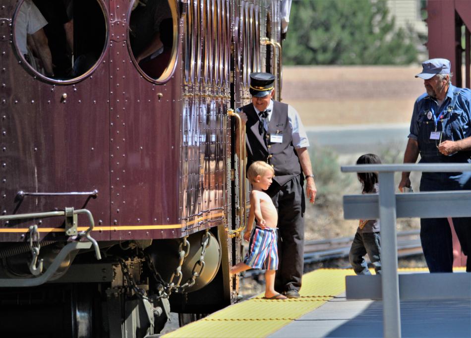 A child steps off the McKeen Car after a ride Thursday at the Nevada State Railroad Museum.