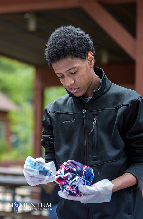 Sadou Yaya, 15, makes a tie-dye shirt at the Nevada Statewide Youth Summer Camp. Photo by Candice Vivien, Nevada Momentum