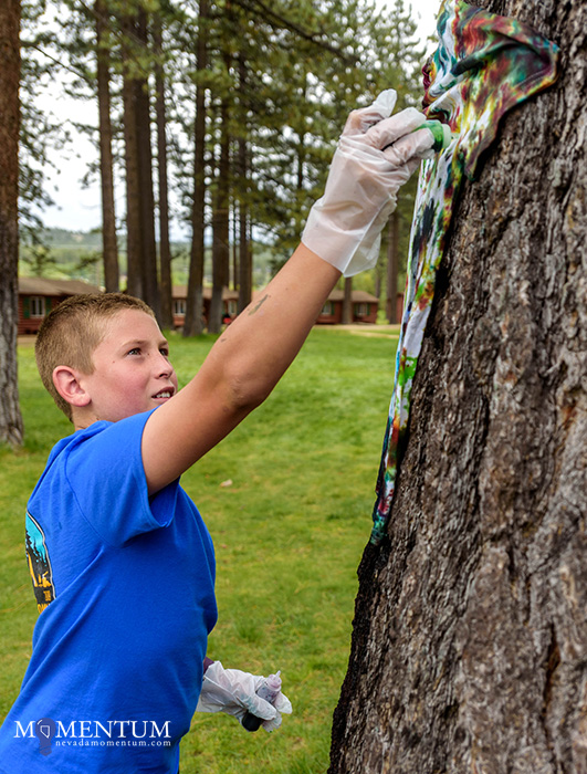 Liam Few, 12, makes a tie-dye shirt at the Nevada Statewide Youth Summer Camp. Photo by Candice Vivien, Nevada Momentum