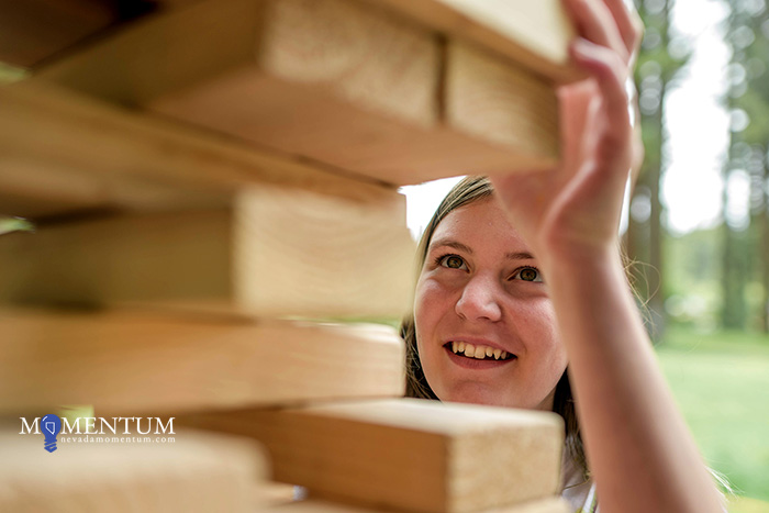 Esty Zanetti, 13, plays Jenga at the Nevada Statewide Youth Summer Camp. Photo by Candice Vivien, Nevada Momentum