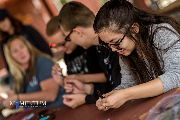 Morningstarr Vella, 17, makes a bracelet at the Nevada Statewide Youth Summer Camp. Photo by Candice Vivien, Nevada Momentum