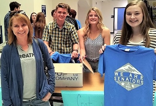 CHS sophomore Honors student Kiera Fields grabbing her 2019-2020 schedule and her free Senators t-shirt accmpanied by her mother