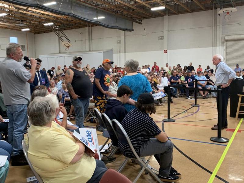 Senator Sanders speaks with a navy veteran suffering from Huntington’s Disease
