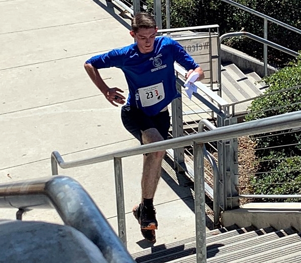 CHS Orienteering student DeSelm climbing the stairs.