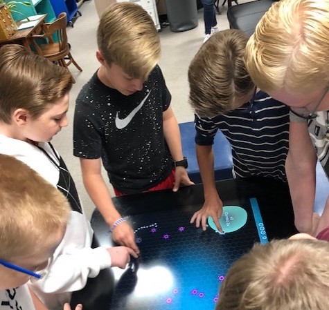 CHS freshman playing games at lunchtime in the library.