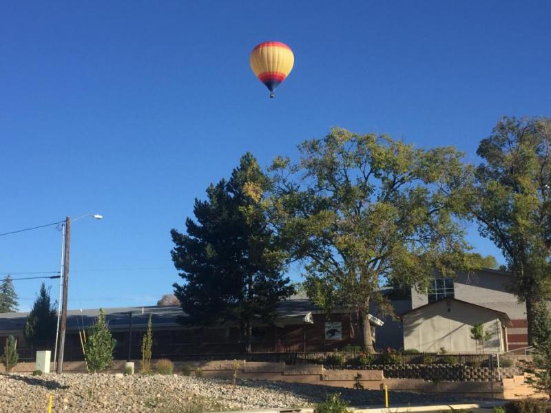 A hot air ballon lifts over Pioneer High School in Carson City on Sunday morning.