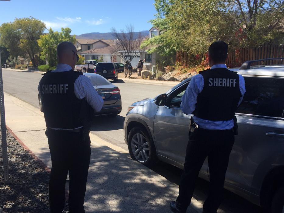 Carson City Sheriff's Office conducts a search of the suspect's home.