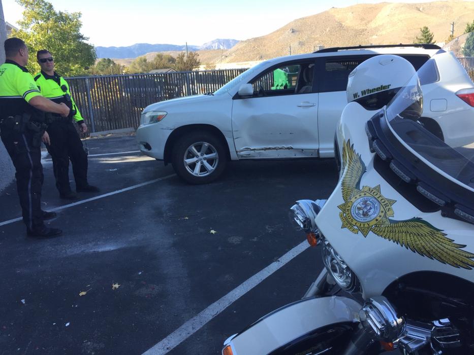 Carson City Sheriff's Office deputies located the damaged vehicle in a parking lot. The suspect was found walking on North Roop.