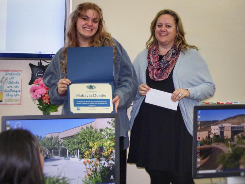 Makayla Mueller is presented with an award from Jaci McCune of the Northwest Regional Professional Development Program.