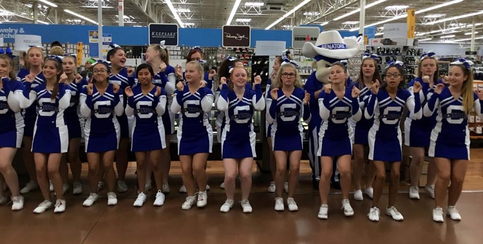 CHS Cheerleaders perform two cheers at Walmart in appreciation for a $5000 grant.