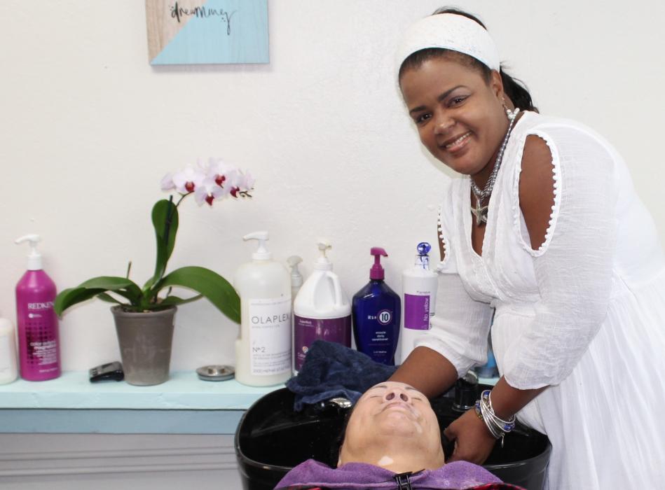 Marbella Hair Salon owner and stylist Yamila Perez tends to a client at her new salon in north Carson. Photo by Ronni Hannaman