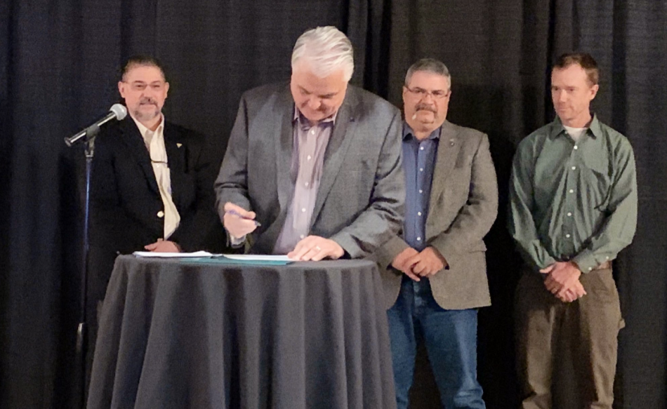 Nevada's governor and representatives from the federal agencies signed the agreement Friday.