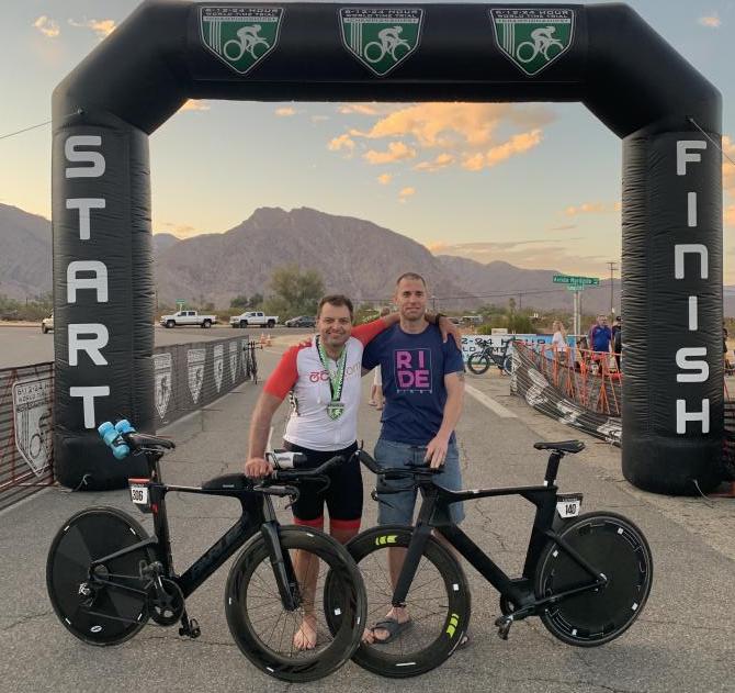 Shane on the right is standing with the 12 hour record holder at the finish line.