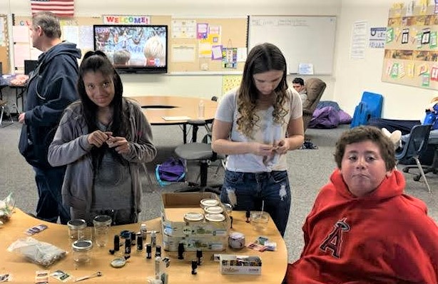 CHS CLS program students helping designing candles for the craft fair.