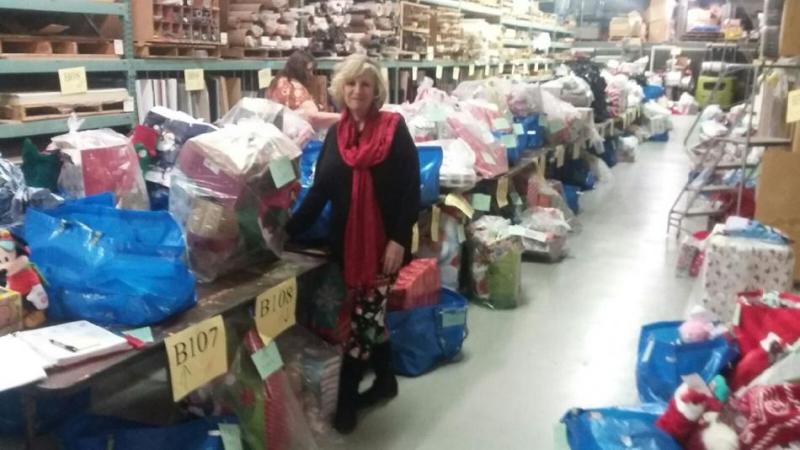 Denise DiMarzo with a selection of donated gifts and toys during 2018's holiday season