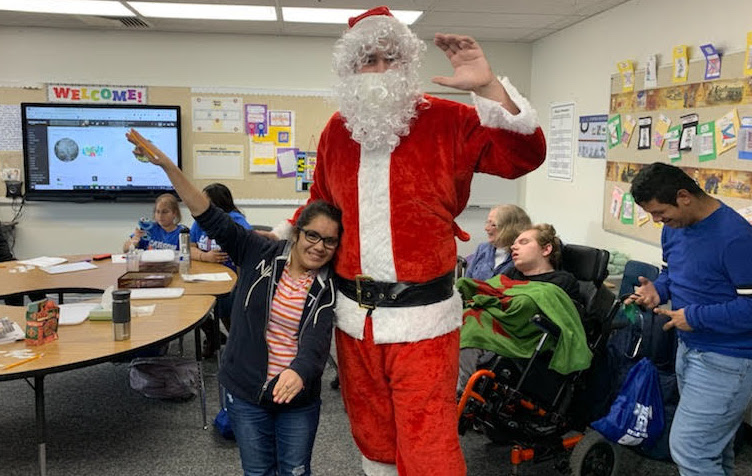 CHS Comprehensive Life Skills students receive gifts from Santa Claus.
