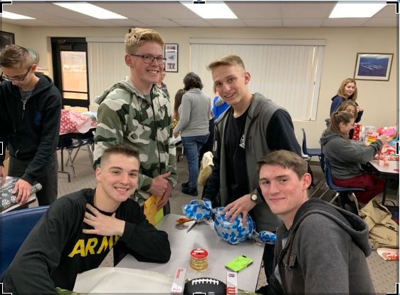 CHS NJROTC cadets wrapping presents for the Angel Tree program.