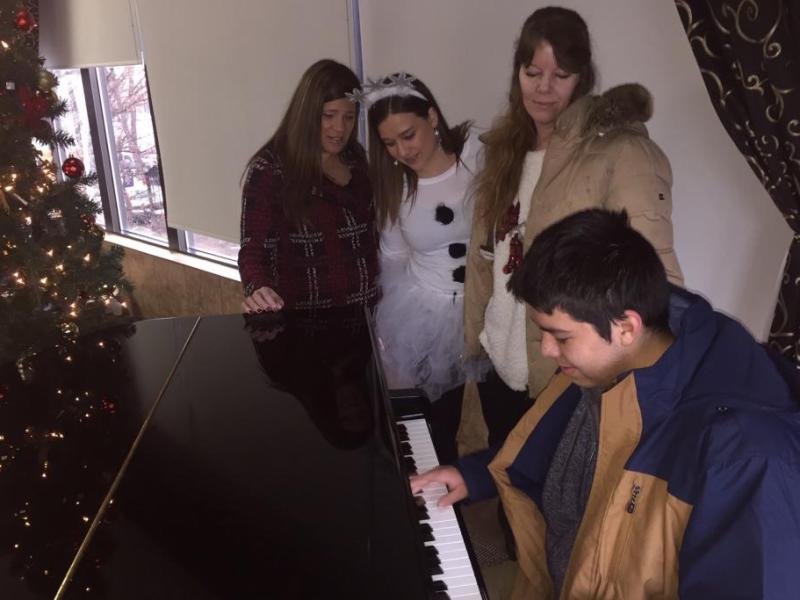 Austin Hernandez, 14,  a recipient of a new parka, dazzled those at the Carson Nugget for the coat drive festivities.