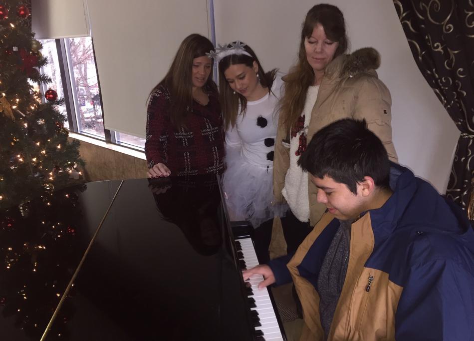 Austin Hernandez, 14,  a recipient of a new parka, dazzled those at the Carson Nugget for the coat drive festivities.