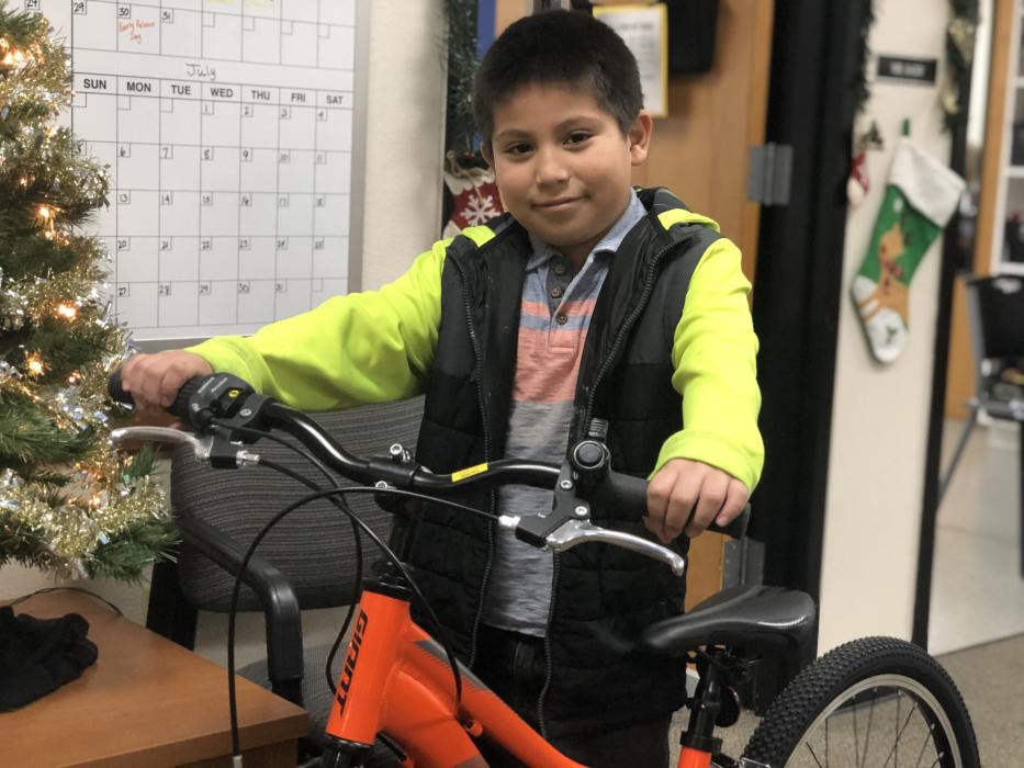 Yahir Herrera with his new bike from Bike Habitat.