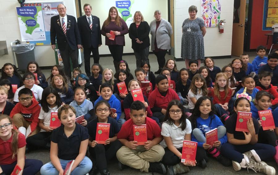 Elks presents dictionaries to third graders at Empire Elementary