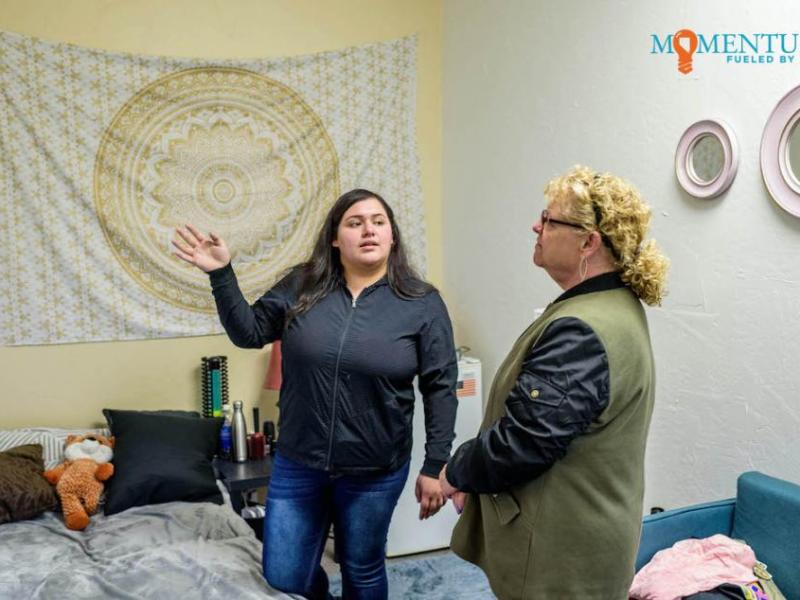 Nancy Mejorado, 17, of Carson High School, explains the dangers in a mock teen bedroom to Karen Styles, of Carson City.
